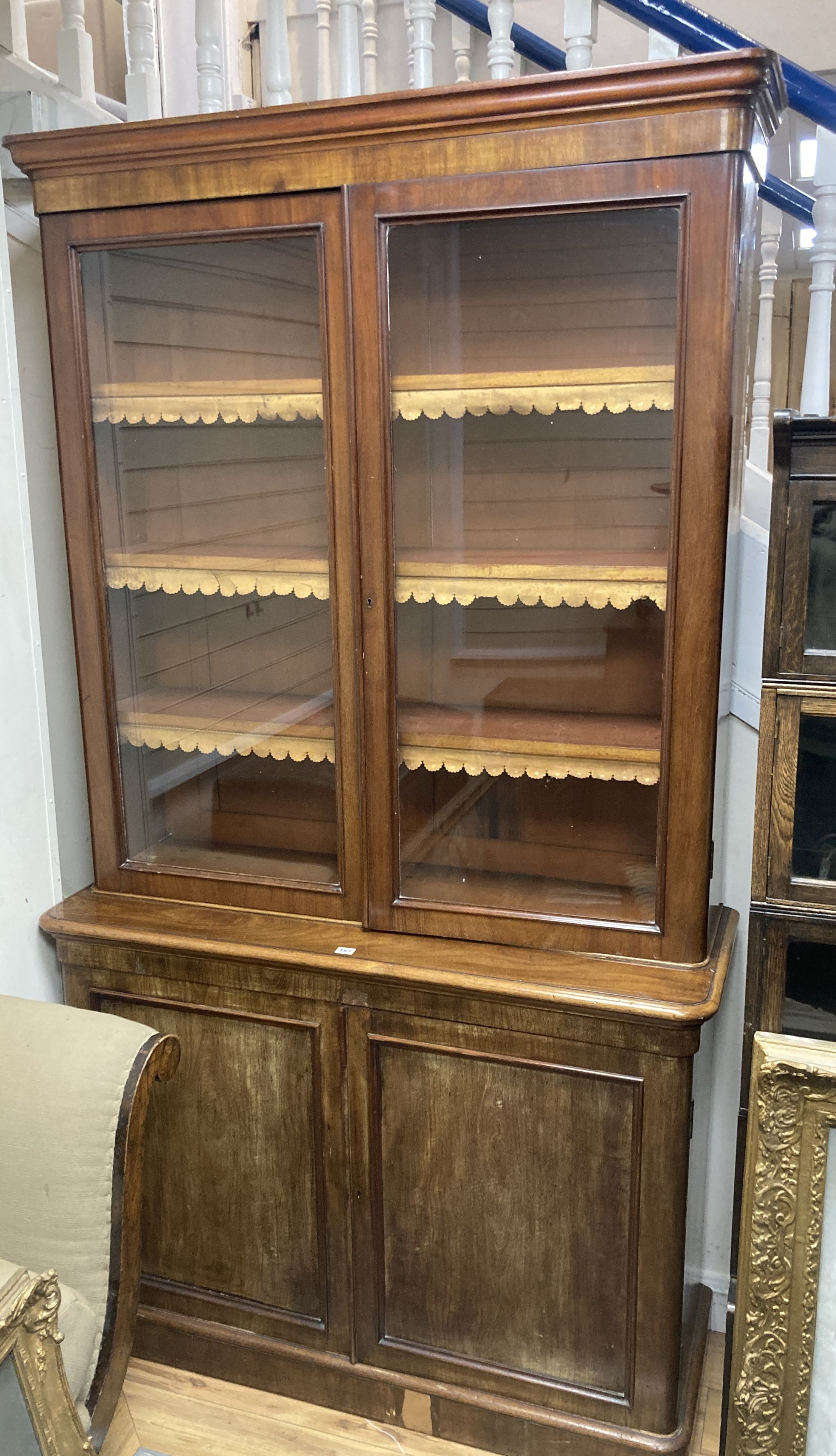 A Victorian mahogany glazed bookcase, width 122cm, depth 43cm, height 225cm
